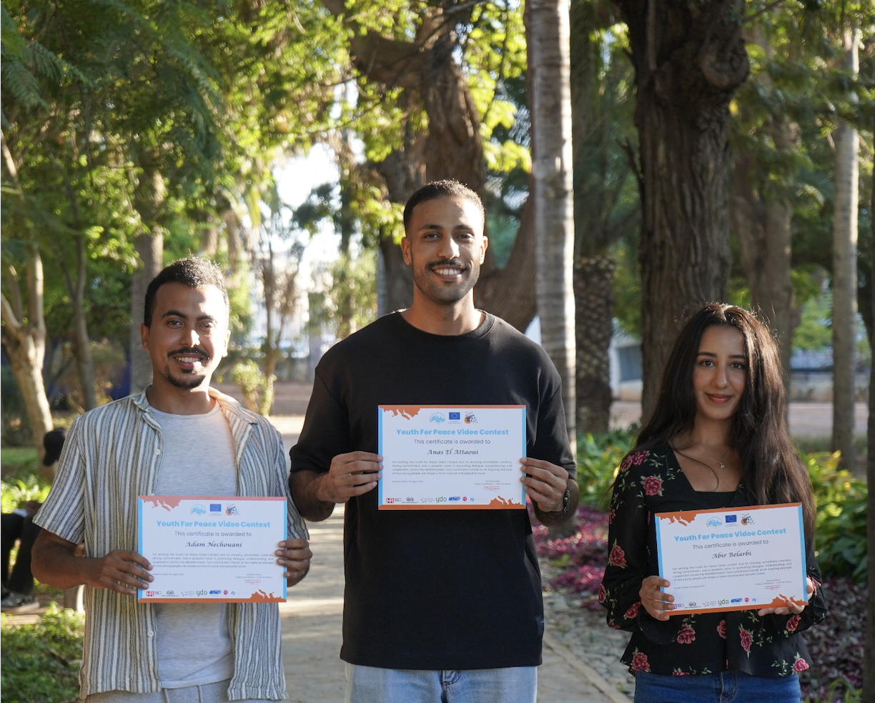 Group photo with winners holding certificates